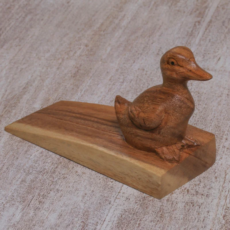 - Remote interactive pet feederHelpful Duck in Brown Handcrafted Suar Wood Duck Doorstop in Brown from Bali